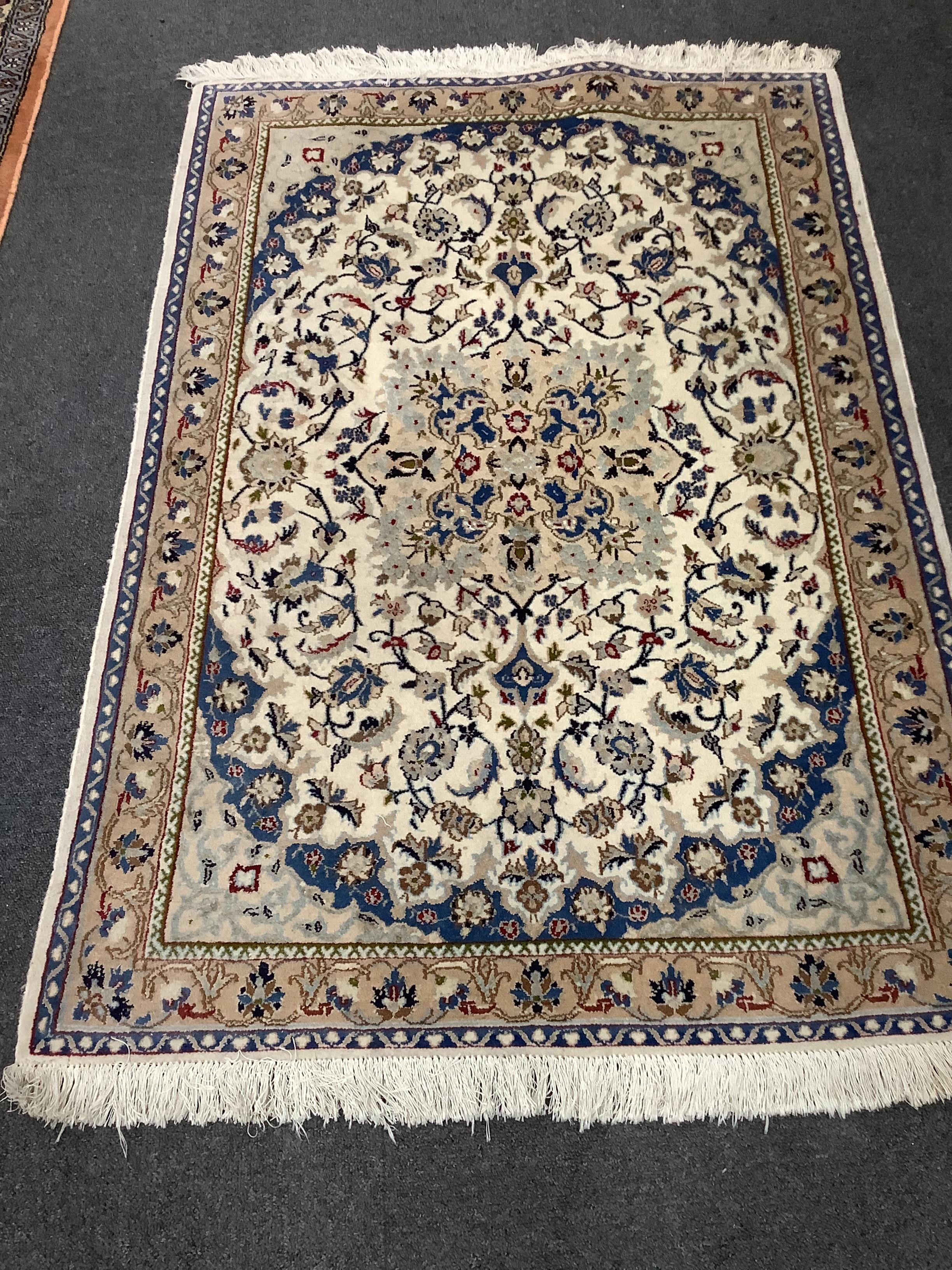 An Isphahan part silk ivory ground rug, 124 x 87cm